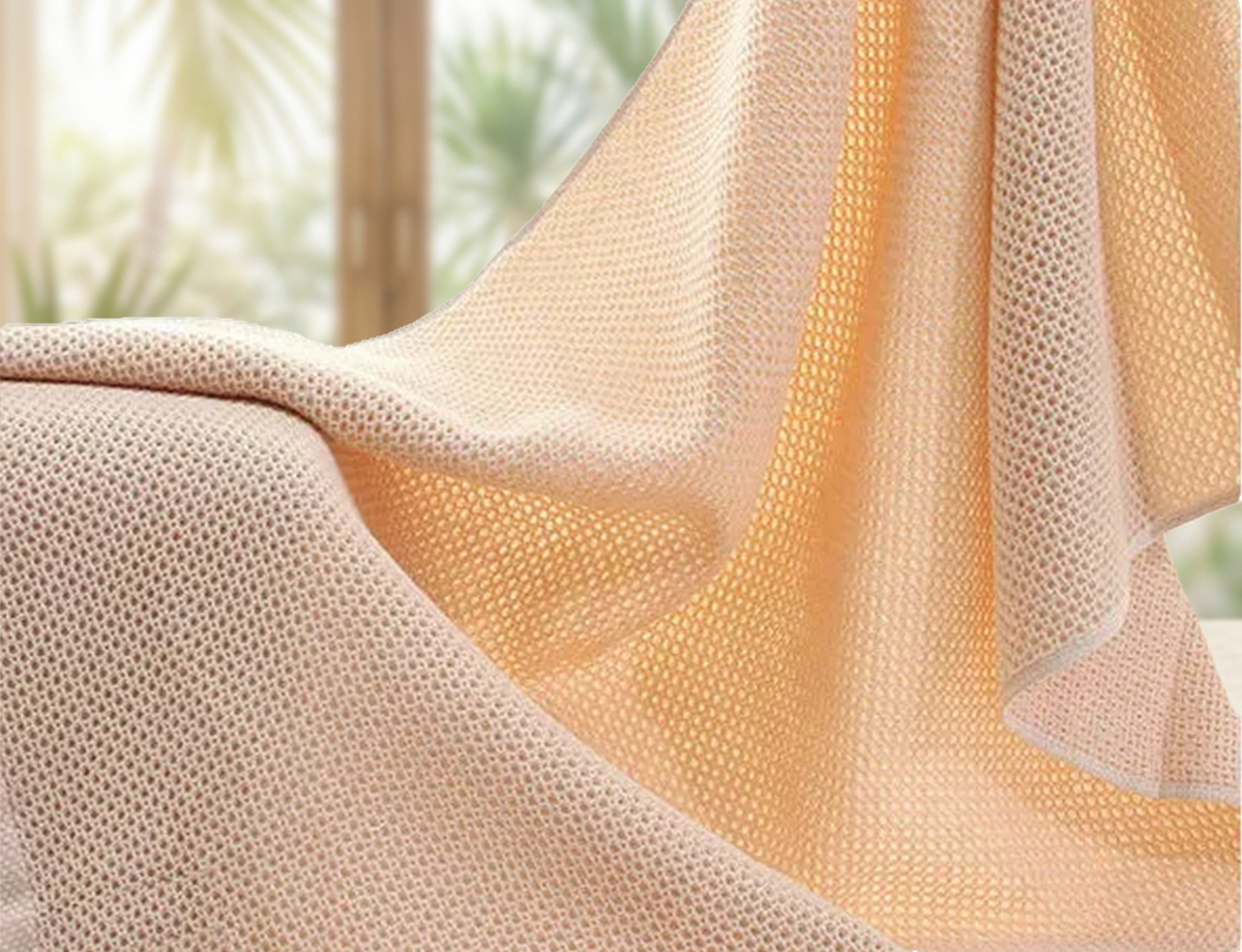 Close-up of the Kylin Wellness honeycomb towel in natural ambient light, highlighting the breathable cotton weave that activates the LumiPur self-purifying technology.